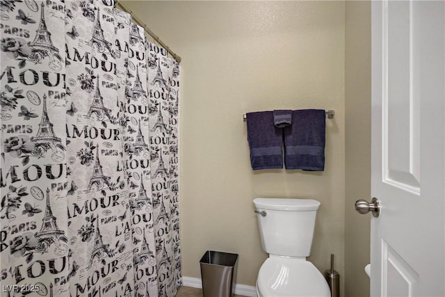 6440 Bristlebird St, North Las Vegas, NV 89084 - full bathroom featuring toilet, curtained shower, and baseboards