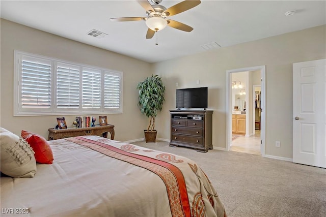 6440 Bristlebird St, North Las Vegas, NV 89084 - bedroom featuring light carpet, baseboards, ceiling fan, and connected bathroom