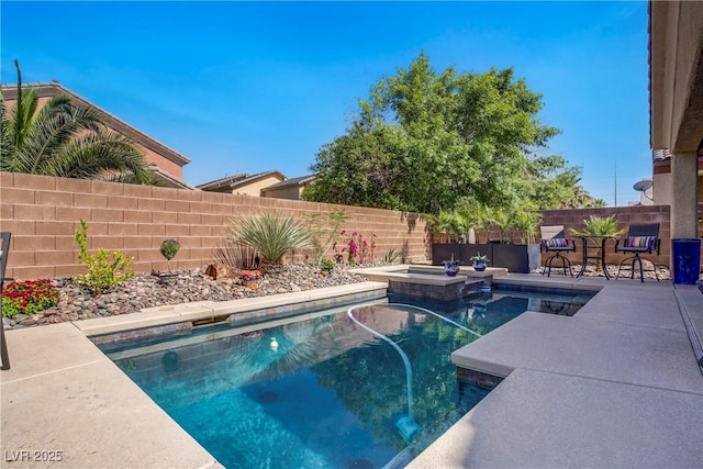 6440 Bristlebird St, North Las Vegas, NV 89084 - view of pool with a fenced backyard, a patio area, and a pool with connected hot tub