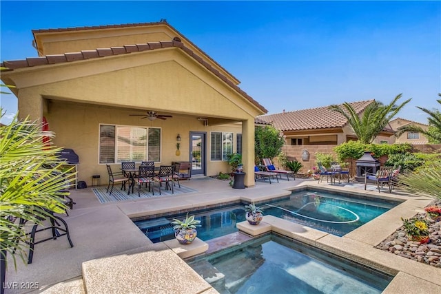 6440 Bristlebird St, North Las Vegas, NV 89084 - view of swimming pool featuring a patio, a ceiling fan, outdoor dining area, and a pool with connected hot tub