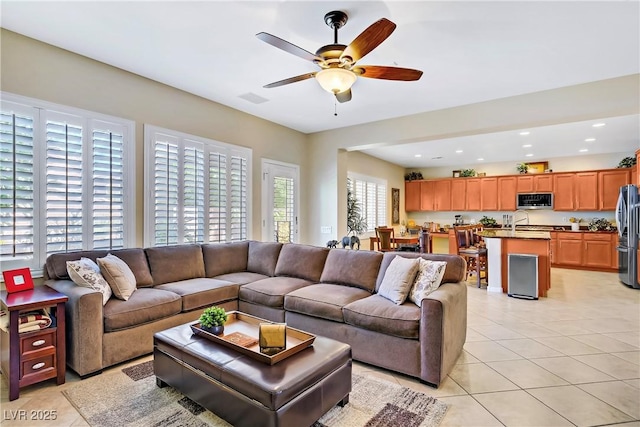6440 Bristlebird St, North Las Vegas, NV 89084 - living area with light tile patterned flooring, a ceiling fan, and recessed lighting