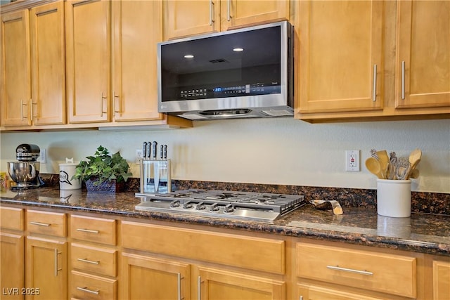 6440 Bristlebird St, North Las Vegas, NV 89084 - kitchen featuring stainless steel appliances and dark stone counters