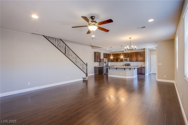 2369 Via Barranca St, Henderson, NV 89044 - unfurnished living room featuring a chandelier, a ceiling fan, dark wood-type flooring, baseboards, and recessed lighting