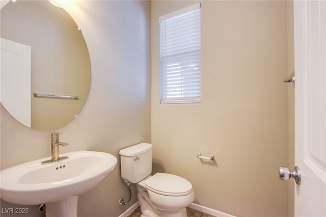 2369 Via Barranca St, Henderson, NV 89044 - bathroom with a sink, toilet, and baseboards