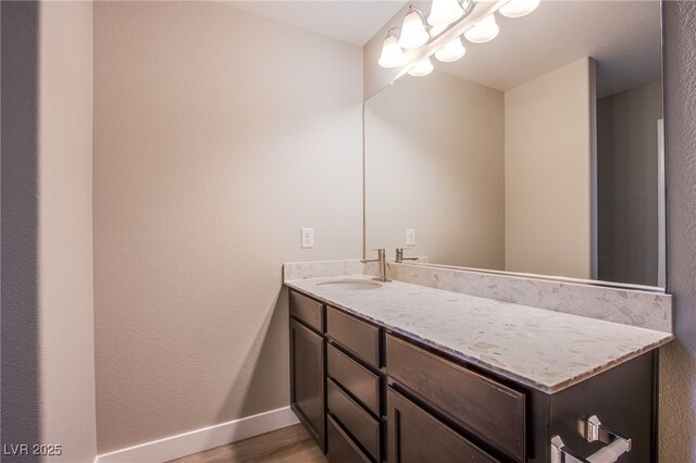 2369 Via Barranca St, Henderson, NV 89044 - bathroom with vanity, baseboards, and wood finished floors