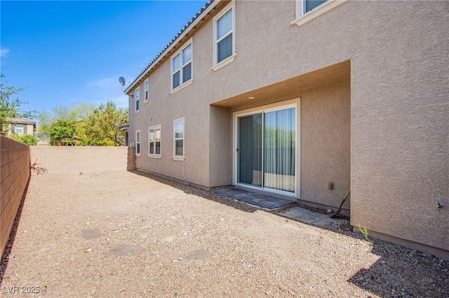 2369 Via Barranca St, Henderson, NV 89044 - rear view of house with stucco siding, a fenced backyard, and a patio