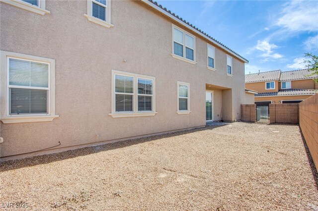 2369 Via Barranca St, Henderson, NV 89044 - back of house with stucco siding and a tiled roof