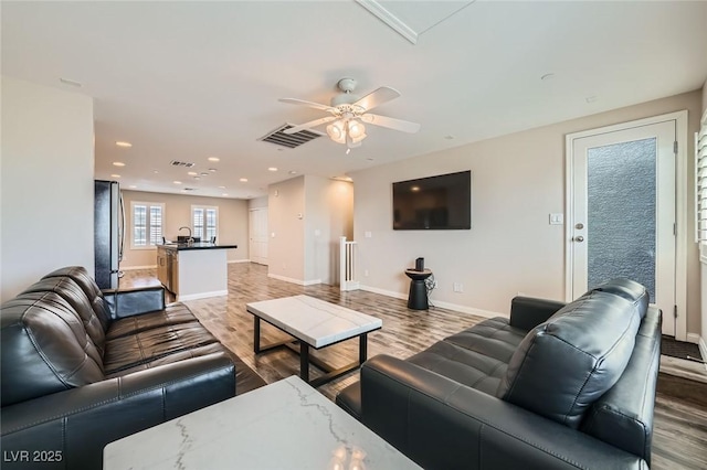 9050 W Tropicana Ave Unit 1015, Las Vegas, NV 89147 - living area with wood finished floors, baseboards, ceiling fan, and recessed lighting