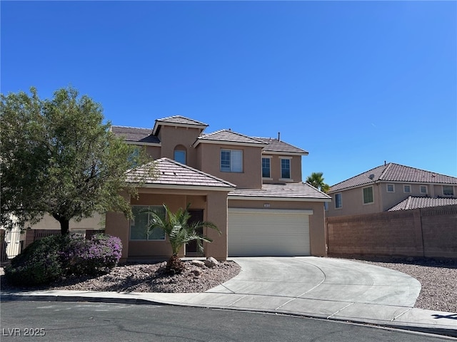 3615 Dutchmans Vine Ct, North Las Vegas, NV 89081 - view of front of house with concrete driveway, stucco siding, an attached garage, and a tiled roof