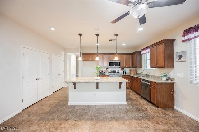 132 Soaring Sky Ave, Henderson, NV 89011 - kitchen featuring stainless steel appliances, a sink, healthy amount of natural light, a kitchen island, and recessed lighting