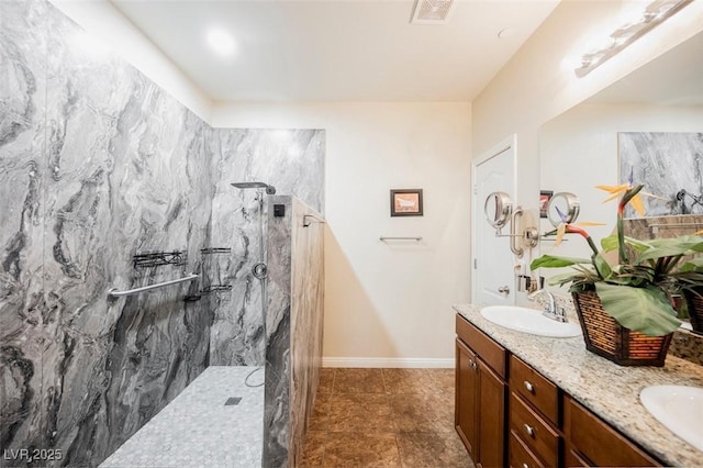 132 Soaring Sky Ave, Henderson, NV 89011 - full bathroom featuring a marble finish shower, double vanity, baseboards, and tile patterned floors