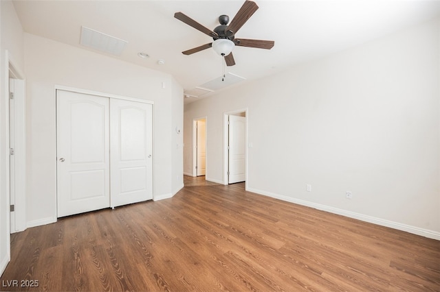 132 Soaring Sky Ave, Henderson, NV 89011 - unfurnished bedroom with wood finished floors, a closet, and baseboards
