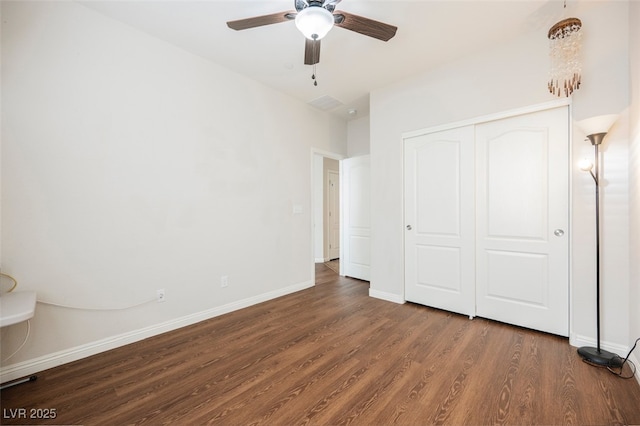 132 Soaring Sky Ave, Henderson, NV 89011 - unfurnished bedroom with wood finished floors, baseboards, a closet, and a ceiling fan