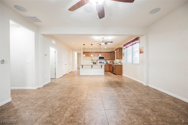 132 Soaring Sky Ave, Henderson, NV 89011 - unfurnished living room with a ceiling fan and baseboards