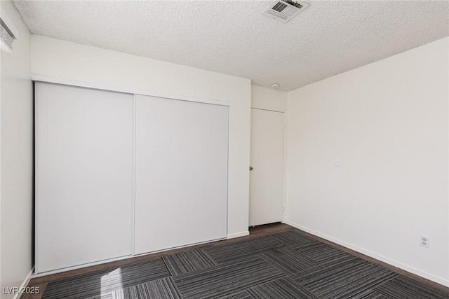 5523 Orchard Ln Unit 0, Las Vegas, NV 89110 - unfurnished bedroom featuring a closet and a textured ceiling