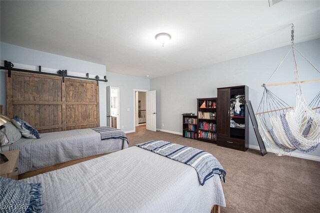 7538 Mustang St, Las Vegas, NV 89131 - carpeted bedroom featuring baseboards and a barn door