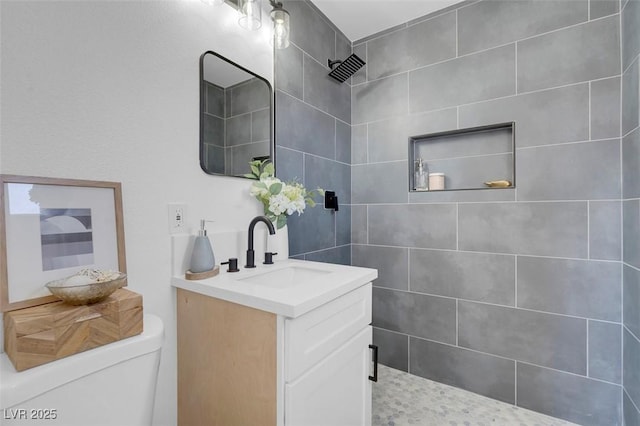 1115 W Nelson Ave, North Las Vegas, NV 89030 - bathroom with vanity, tiled shower, and toilet