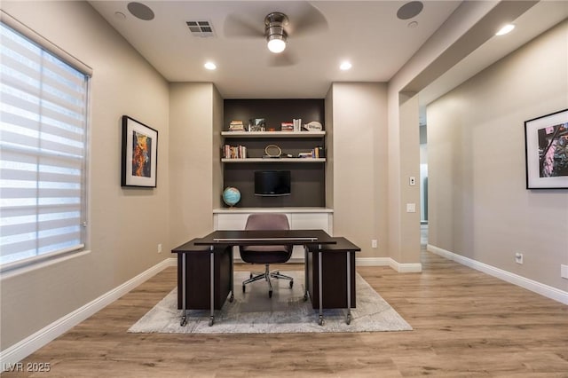 2896 Grande Arch St, Henderson, NV 89044 - office with light wood-type flooring, a ceiling fan, built in features, baseboards, and recessed lighting