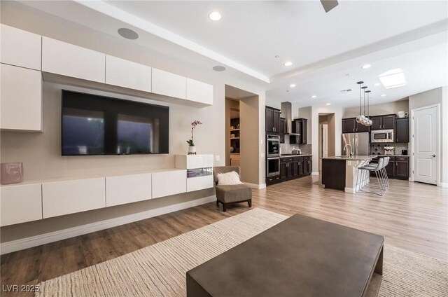 2896 Grande Arch St, Henderson, NV 89044 - living area with light wood finished floors and recessed lighting