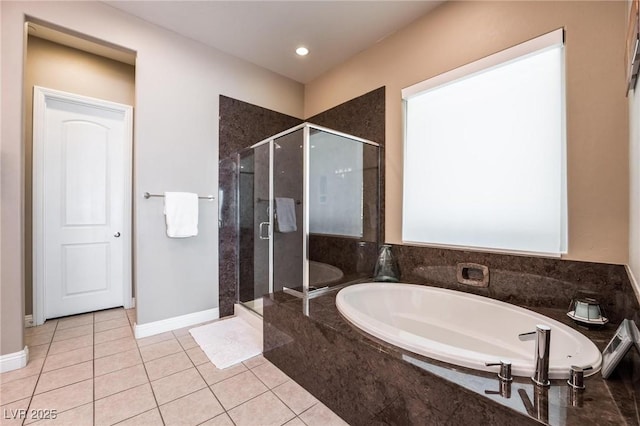 2896 Grande Arch St, Henderson, NV 89044 - full bathroom with a stall shower, a garden tub, tile patterned flooring, baseboards, and recessed lighting