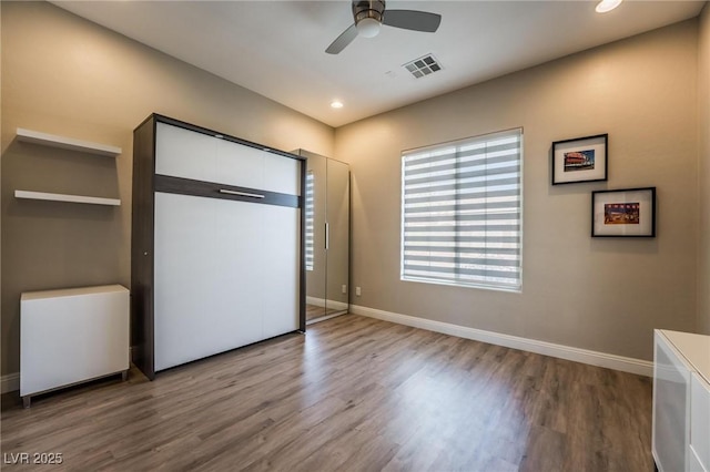 2896 Grande Arch St, Henderson, NV 89044 - unfurnished bedroom featuring wood finished floors, baseboards, and recessed lighting