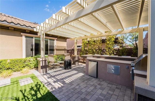 2896 Grande Arch St, Henderson, NV 89044 - view of patio / terrace featuring exterior kitchen and a pergola