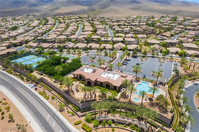 2896 Grande Arch St, Henderson, NV 89044 - aerial view of residential area with a pool area and a mountainous background