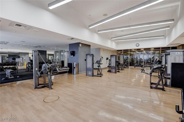 4525 Dean Martin Dr Unit 2109, Las Vegas, NV 89103 - gym with wood finished floors and a towering ceiling