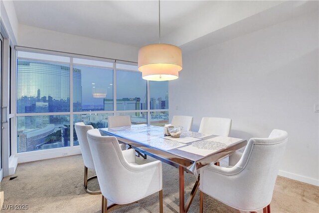 4525 Dean Martin Dr Unit 2109, Las Vegas, NV 89103 - dining area with light carpet and baseboards