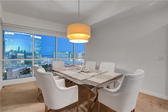 4525 Dean Martin Dr Unit 2109, Las Vegas, NV 89103 - carpeted dining room featuring baseboards