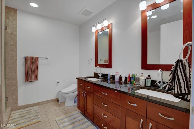 4525 Dean Martin Dr Unit 2109, Las Vegas, NV 89103 - full bathroom with double vanity, toilet, tile patterned flooring, a shower stall, and baseboards