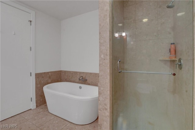 4525 Dean Martin Dr Unit 2109, Las Vegas, NV 89103 - bathroom with a shower stall, a soaking tub, and tile patterned floors
