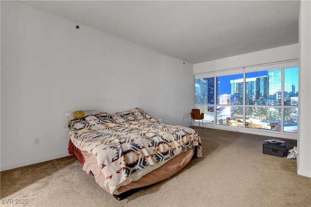 4525 Dean Martin Dr Unit 2109, Las Vegas, NV 89103 - bedroom with carpet floors, a city view, and baseboards