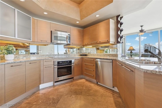 222 Karen Ave Unit 3208, Las Vegas, NV 89109 - kitchen with stainless steel appliances, a sink, ceiling fan, light stone countertops, and recessed lighting