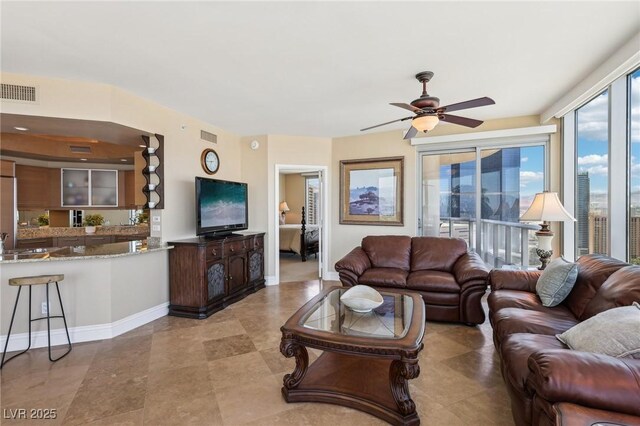 222 Karen Ave Unit 3208, Las Vegas, NV 89109 - living area featuring a ceiling fan and baseboards