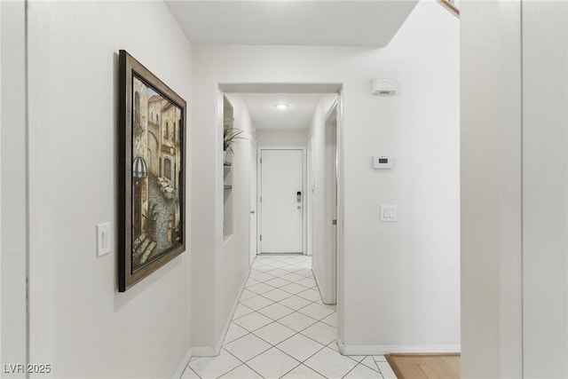 9785 Turtle Head Ct, Las Vegas, NV 89117 - hallway featuring baseboards and light tile patterned floors