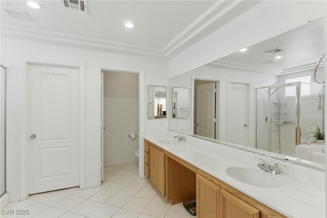 9785 Turtle Head Ct, Las Vegas, NV 89117 - full bath with a shower stall, double vanity, toilet, tile patterned flooring, and ornamental molding