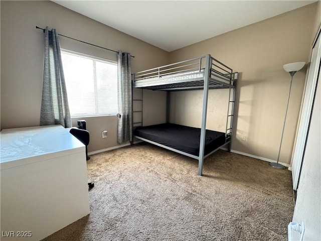 5750 E Hacienda Ave Unit 107, Las Vegas, NV 89122 - unfurnished bedroom featuring carpet and baseboards