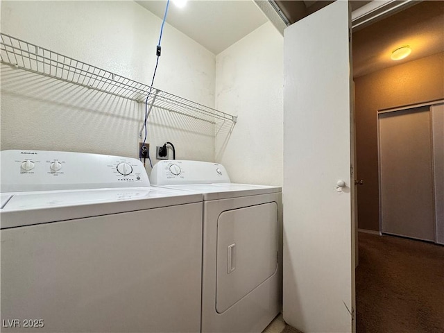 5750 E Hacienda Ave Unit 107, Las Vegas, NV 89122 - laundry area featuring washing machine and dryer and light colored carpet