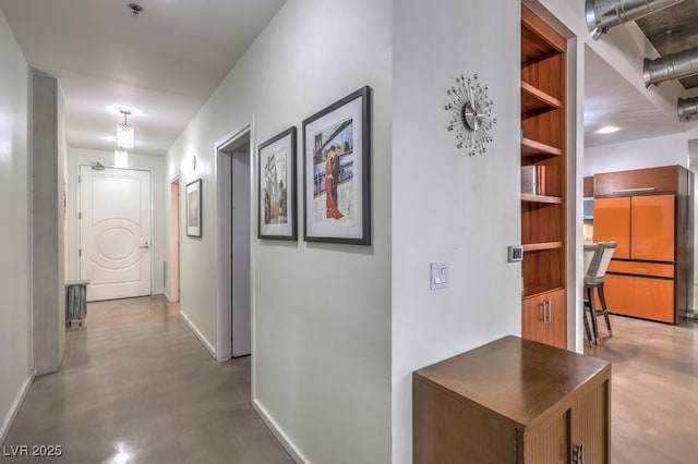 900 Las Vegas Blvd Unit 1208, Las Vegas, NV 89101 - hallway featuring concrete floors, baseboards, and a desk