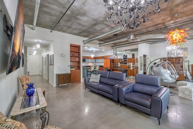 900 Las Vegas Blvd Unit 1208, Las Vegas, NV 89101 - living area with finished concrete floors and a chandelier
