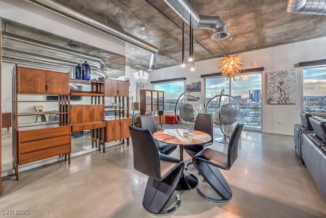 900 Las Vegas Blvd Unit 1208, Las Vegas, NV 89101 - dining area with a chandelier and concrete flooring