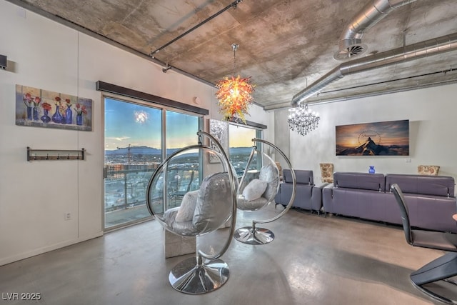 900 Las Vegas Blvd Unit 1208, Las Vegas, NV 89101 - dining room featuring concrete flooring, a chandelier, and baseboards