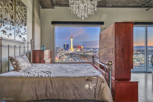 900 Las Vegas Blvd Unit 1208, Las Vegas, NV 89101 - bedroom featuring a city view and a chandelier
