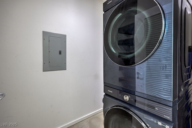 900 Las Vegas Blvd Unit 1208, Las Vegas, NV 89101 - laundry area with electric panel, estacked washer and dryer, and baseboards