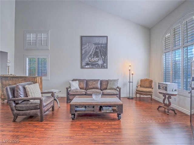 2732 Dune Cove Rd, Las Vegas, NV 89117 - living room featuring healthy amount of natural light, wood finished floors, high vaulted ceiling, and baseboards