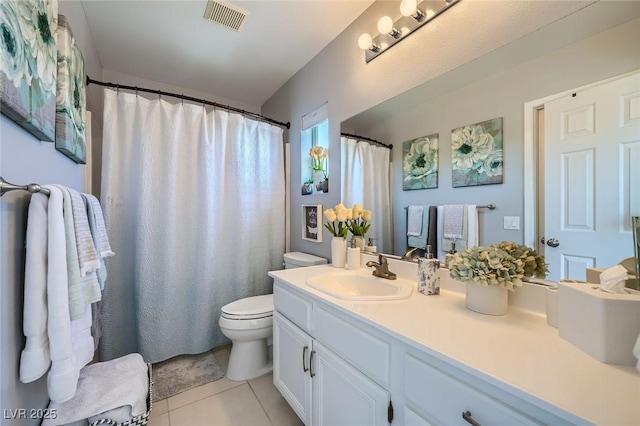 1701 Drifters Peak St, Las Vegas, NV 89144 - bathroom with toilet, vanity, and tile patterned flooring