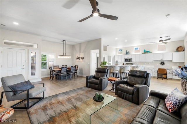 10504 Button Willow Dr, Las Vegas, NV 89134 - living area with ceiling fan, light wood finished floors, recessed lighting, and baseboards