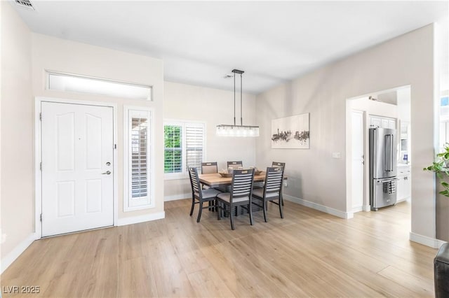 10504 Button Willow Dr, Las Vegas, NV 89134 - dining area with light wood-type flooring and baseboards