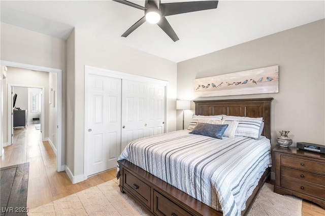 10504 Button Willow Dr, Las Vegas, NV 89134 - bedroom featuring light wood-style flooring, a closet, a ceiling fan, and baseboards